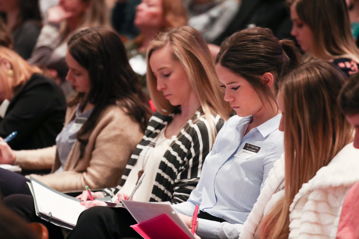 Students taking notes at a Keeter Center forum
